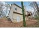 Exterior view of the home, surrounded by tall trees and foliage at 2845 Hickory Cir, Snellville, GA 30078