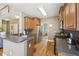 Open kitchen with a breakfast bar, stainless steel appliances, and seamless flow to the living spaces at 2845 Hickory Cir, Snellville, GA 30078