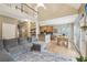 Inviting living room with a soaring ceiling, hardwood floors, cozy seating, and a seamless connection to the kitchen at 2845 Hickory Cir, Snellville, GA 30078