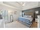 Relaxing main bedroom featuring tray ceilings, accent wall, and large windows offering natural light and peaceful views at 2845 Hickory Cir, Snellville, GA 30078