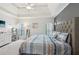 Bright main bedroom featuring tray ceilings, accent wall, and large windows providing natural light, perfect for relaxation at 2845 Hickory Cir, Snellville, GA 30078