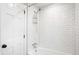 Modern bathroom with a white tiled shower and chrome fixtures at 3240 Pinestream Nw Rd, Atlanta, GA 30327