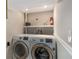 Bright laundry room featuring modern appliances and white walls at 3240 Pinestream Nw Rd, Atlanta, GA 30327
