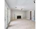 Spacious living room with fireplace and doors leading to the outside at 3240 Pinestream Nw Rd, Atlanta, GA 30327