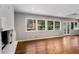 Bright living area with hardwood floors, large windows, and access to the outdoor living space at 3240 Pinestream Nw Rd, Atlanta, GA 30327