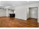 Open-concept layout with kitchen island and hardwood floors connecting the living spaces seamlessly at 3240 Pinestream Nw Rd, Atlanta, GA 30327