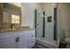 Modern bathroom featuring a glass shower with custom tile work and granite vanity at 40 Cumberland Dr, Rex, GA 30273