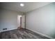 Bedroom features gray walls, hardwood floors, and access to an adjoining space at 40 Cumberland Dr, Rex, GA 30273