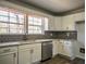 Bright kitchen featuring stainless steel appliances, subway tile backsplash, and white cabinets at 40 Cumberland Dr, Rex, GA 30273