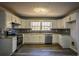 Bright kitchen featuring stainless steel appliances, subway tile backsplash, and white cabinets at 40 Cumberland Dr, Rex, GA 30273