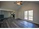 Inviting living space with large windows, sleek flooring, and access to the kitchen at 40 Cumberland Dr, Rex, GA 30273