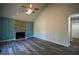 Spacious living room with vaulted ceilings, a fireplace, and sleek floors at 40 Cumberland Dr, Rex, GA 30273