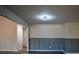 Well lit living room area with paneled walls, decorative ceilings, and modern lighting fixtures at 40 Cumberland Dr, Rex, GA 30273