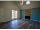 Bright living room with vaulted ceilings, fireplace, and large windows overlooking the yard at 40 Cumberland Dr, Rex, GA 30273