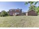 Backyard view of a brick home with a deck and lots of green space at 4840 Pisgah Rd, Cumming, GA 30028