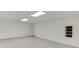 This basement features a large open space with tiled floor and drop ceiling at 4840 Pisgah Rd, Cumming, GA 30028