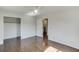 Hardwood floors, ceiling fan, and closet in this cozy bedroom near stairway access at 4840 Pisgah Rd, Cumming, GA 30028
