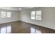 This bedroom features hardwood floors, natural light and ceiling fan at 4840 Pisgah Rd, Cumming, GA 30028