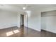 This room features hardwood floors, closet, ceiling fan and door to the hallway at 4840 Pisgah Rd, Cumming, GA 30028