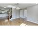 Open dining room featuring hardwood floors, updated lighting, and open floor plan at 4840 Pisgah Rd, Cumming, GA 30028