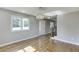 Dining room with hardwood floors, updated lighting, and view of the front yard at 4840 Pisgah Rd, Cumming, GA 30028