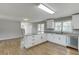 Open concept kitchen features granite counters, an island and stainless steel appliances at 4840 Pisgah Rd, Cumming, GA 30028