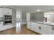 Updated kitchen features a granite countertop island and stainless steel wall oven at 4840 Pisgah Rd, Cumming, GA 30028