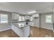 Bright kitchen features white cabinets, stainless steel appliances, and granite countertops at 4840 Pisgah Rd, Cumming, GA 30028