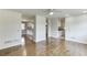 Spacious living room with hardwood floors that opens to the kitchen at 4840 Pisgah Rd, Cumming, GA 30028