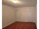 Empty bedroom with hardwood floors and plenty of natural light at 553 Rockbridge Trl, Stone Mountain, GA 30083