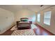 Bright bedroom with vaulted ceilings, hardwood floors, and neutral walls at 553 Rockbridge Trl, Stone Mountain, GA 30083