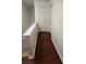 Hallway with hardwood floors and white trim, connecting different rooms at 553 Rockbridge Trl, Stone Mountain, GA 30083