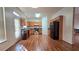 Bright kitchen featuring wooden cabinets, black appliances, and hardwood floors at 553 Rockbridge Trl, Stone Mountain, GA 30083