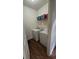 A conveniently located laundry room features a washer, dryer, and shelving for ample storage at 553 Rockbridge Trl, Stone Mountain, GA 30083