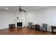 Spacious living room featuring hardwood floors, a fireplace, and neutral paint at 553 Rockbridge Trl, Stone Mountain, GA 30083
