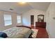 Large bedroom with vaulted ceilings, hardwood floors, and a spacious layout at 553 Rockbridge Trl, Stone Mountain, GA 30083