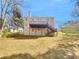 Exterior view of a home with a spacious backyard and a wooden deck, great for outdoor entertaining at 1110 Robert Pointe Way, Lawrenceville, GA 30045