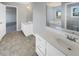Bright bathroom with double sinks, soaking tub, and a separate toilet room at 1110 Robert Pointe Way, Lawrenceville, GA 30045