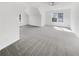 Upstairs bedroom with gray carpet, natural light, and neutral paint, offering a cozy retreat at 1110 Robert Pointe Way, Lawrenceville, GA 30045