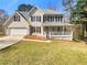 Charming two-story home with a welcoming front porch and a two-car garage, set on a well-maintained lawn at 1110 Robert Pointe Way, Lawrenceville, GA 30045