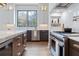 Contemporary kitchen featuring marble countertops, stainless steel appliances, and natural light at 1442 Cedarhurst Dr, Dunwoody, GA 30338