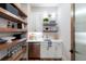 Well-organized pantry featuring open shelving, ample storage, and a convenient sink area at 1442 Cedarhurst Dr, Dunwoody, GA 30338