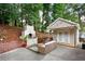 Cozy backyard featuring a fireplace and a small outdoor structure with string lights at 1584 Carroll Nw Dr, Atlanta, GA 30318