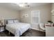 Inviting bedroom with a comfortable bed, a ceiling fan, and a well-lit study area at 1584 Carroll Nw Dr, Atlanta, GA 30318