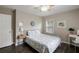 Calming bedroom with soft lighting, a comfortable queen-sized bed, and a functional workspace area at 1584 Carroll Nw Dr, Atlanta, GA 30318