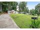 Charming home with a well-manicured front lawn at 1584 Carroll Nw Dr, Atlanta, GA 30318