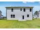 Backyard view of new home with lawn at 205 Groveton Ct, Euharlee, GA 30145