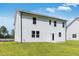 Backyard view of new home with lush lawn at 205 Groveton Ct, Euharlee, GA 30145