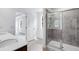A modern bathroom with double vanity, quartz countertop, and tiled shower enclosure at 205 Groveton Ct, Euharlee, GA 30145