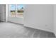 Bright bedroom with neutral carpeting, large windows, and ample natural light at 205 Groveton Ct, Euharlee, GA 30145